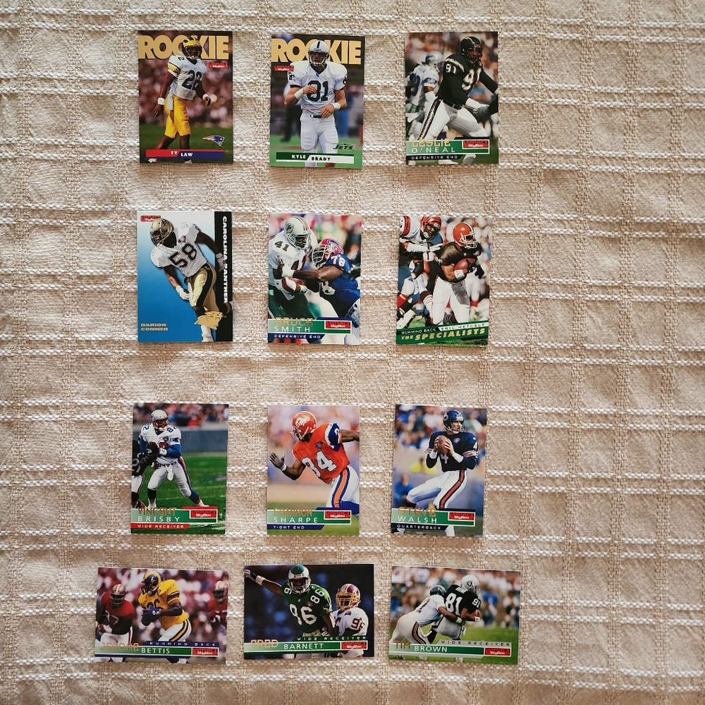 1995 Skybox Impact NFL Cards- includes four HOFers and Ty Law RC -12 cards total